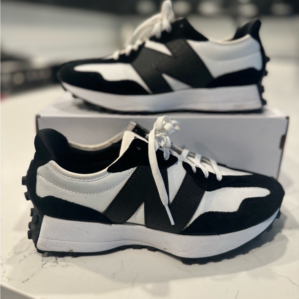 Women’s New Balance Black and White Sneakers